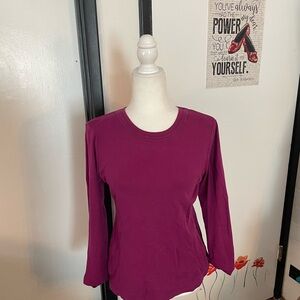 Fuchsia or raspberry colored crew/scoop neck long sleeve shirt